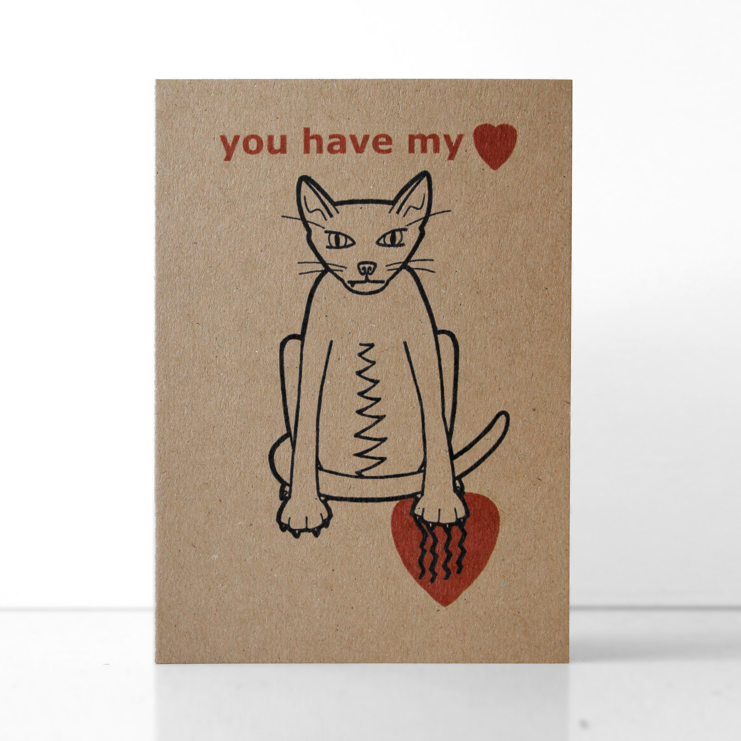 Valentines card - you have my heart - snaggle toothed cat - an illustration of a snaggle toothed cat scratching a heart, printed on 290gsm Kraft card