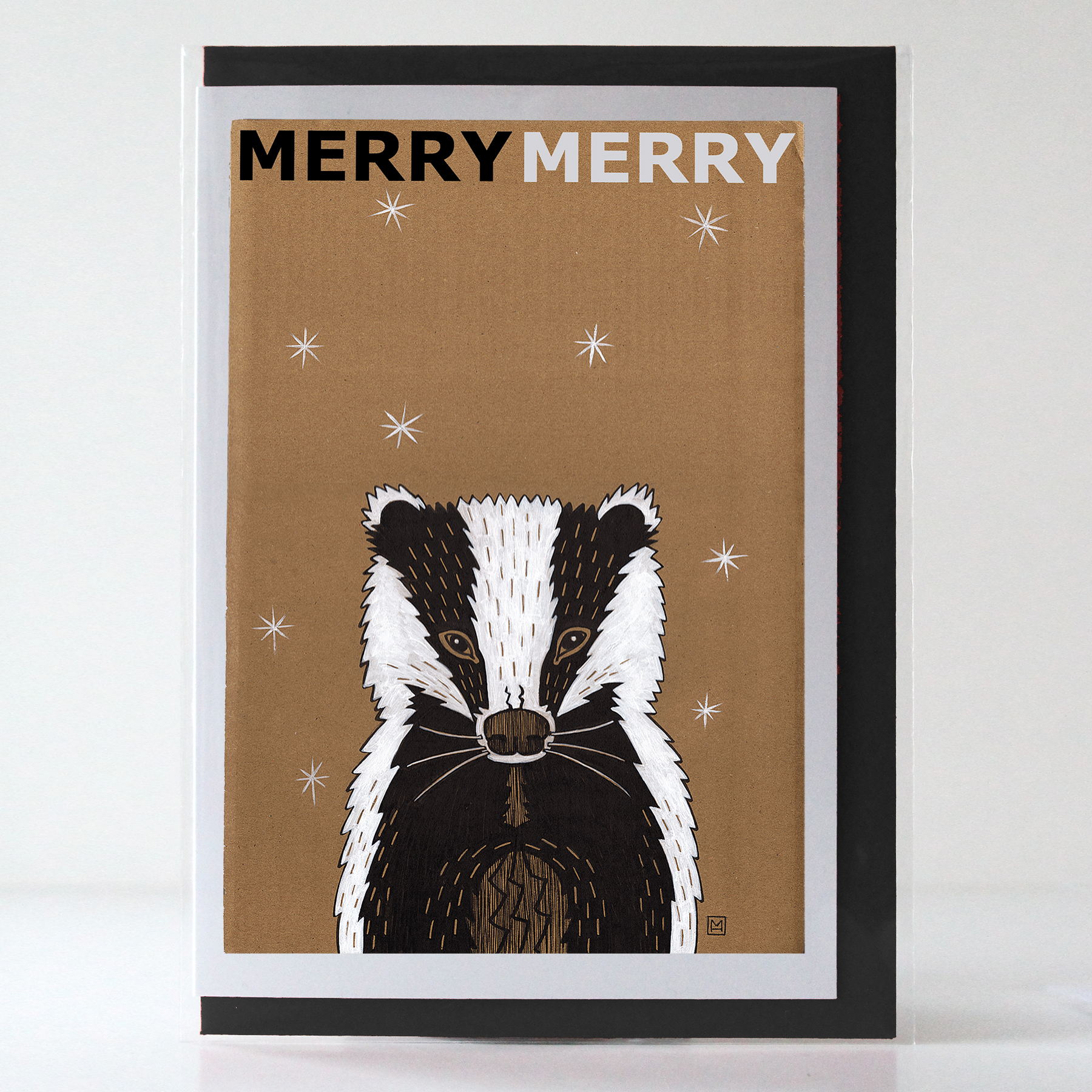 Badger in the snow festive greetings card, illustrated by Marianne Hazlewood, with Merry Merry on the front, blank inside Badger in the snow festive greetings card, illustrated by Marianne Hazlewood, with Merry Merry on the front, blank inside